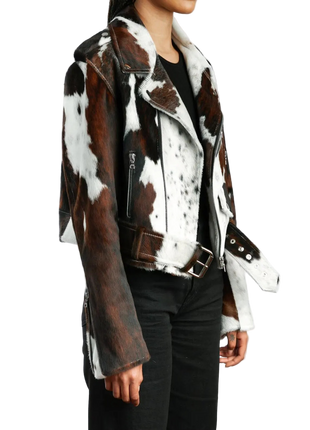 Person wearing a brown and white cowhide leather jacket 