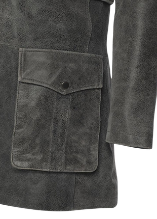 Close-up of a dark gray suede coat with a pocket