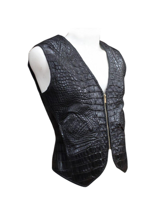 Black crocodile-patterned leather vest on a mannequin against 
