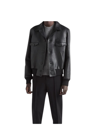 Man wearing a dark leather jacket and black pants 