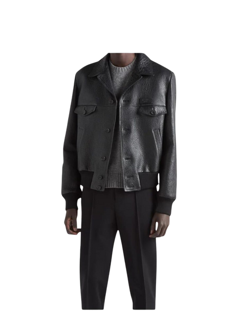 Man wearing a dark leather jacket and black pants 