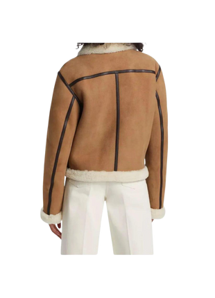 Brown jacket with black accents worn by a person 