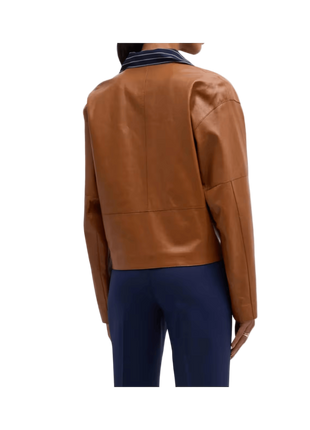 Brown leather jacket worn by a person