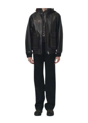 Person wearing a black leather jacket and pants 