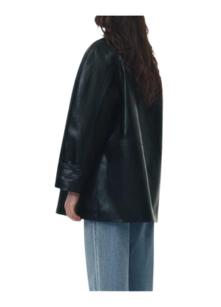 Black leather jacket worn by a person 