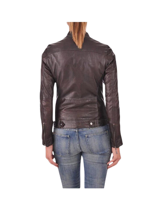 Person wearing a brown leather jacket and blue jeans 