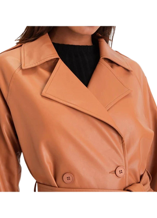 brown leather coat worn by a person 